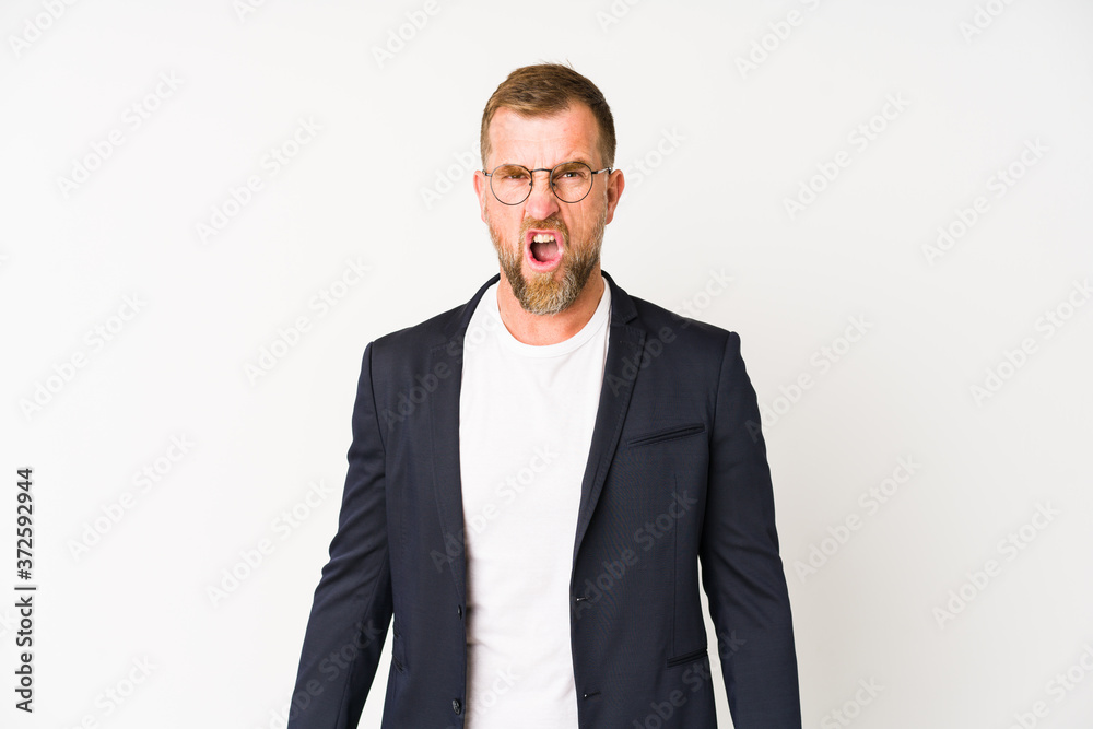 Senior business man isolated on white background screaming very angry and aggressive. Senior business man isolated on white background screaming very angry and aggressive.