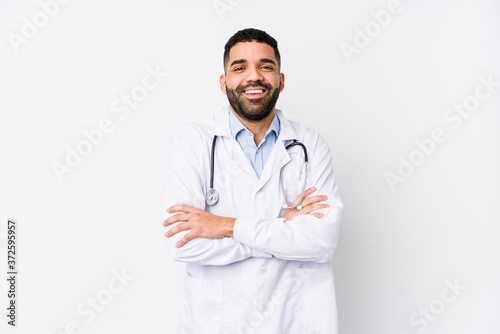 Young arabian doctor man isolated laughing and having fun. photo