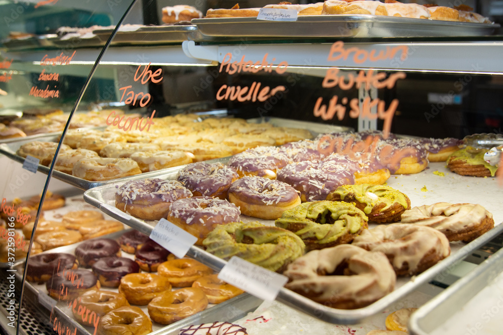 Bakery case of fresh-made donuts