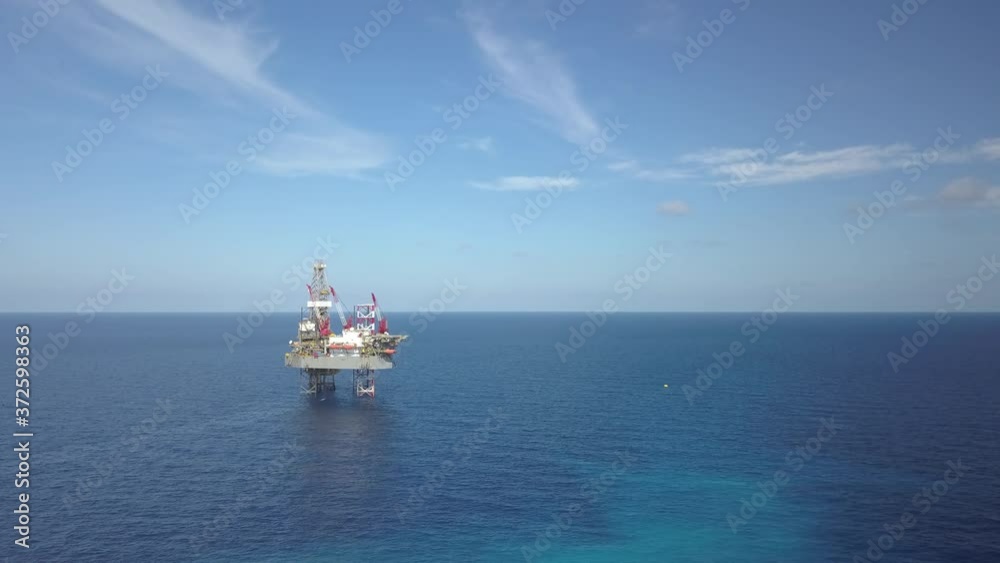 Aerial view from a drone of an offshore jack up rig at the offshore location during day time
Aerial view from a drone of an offshore jack up rig at the offshore location during day time