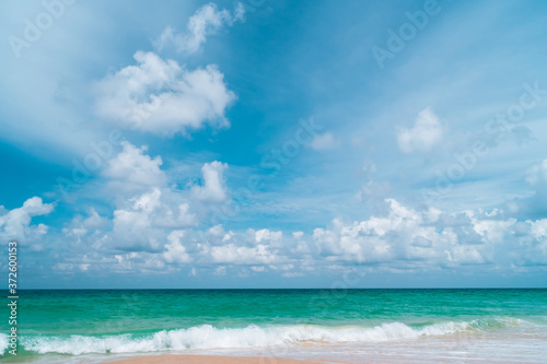 Tropical nature clean beach and white sand in summer with sun light blue sky and bokeh background.