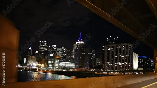 Downtown Pittsburgh Illuminated City Skyline PPG Building at Night Aerial with Water Reflection 4K photo