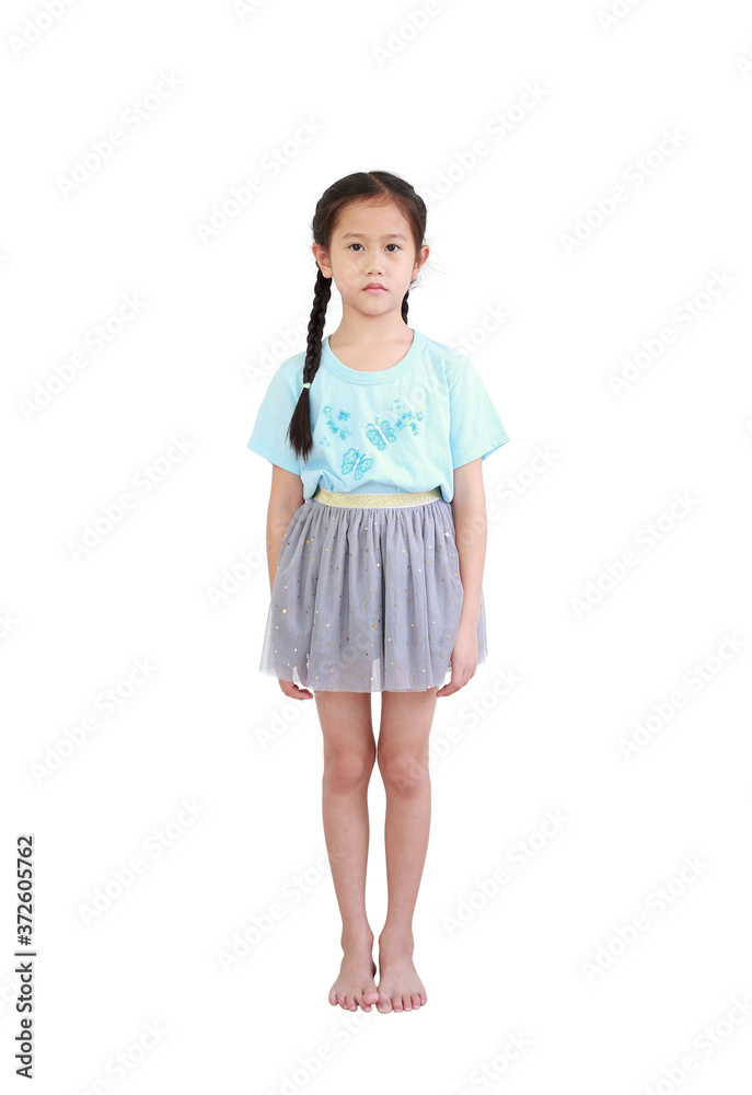 Peaceful little asian child girl standing with pigtail hair isolated over white background. Full length Peaceful little asian child girl standing with pigtail hair isolated over white background. Full length