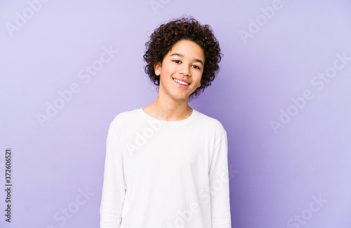 African american little boy isolated happy, smiling and cheerful. © Asier