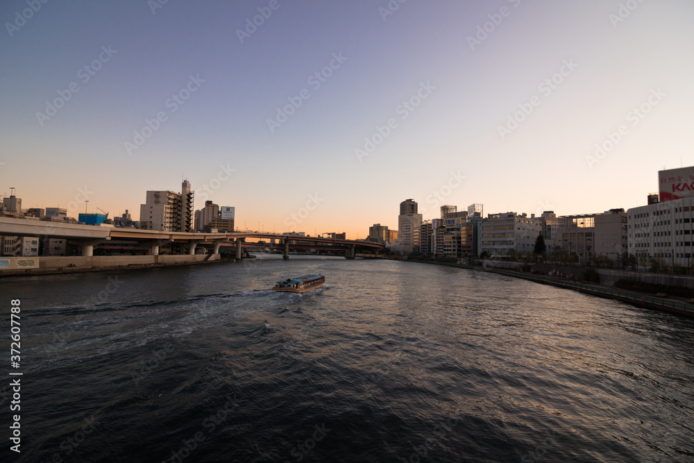 Water Taxi Heading Down the Sumida River Towards Tokyo Bay