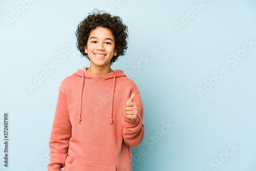 African american little boy isolated smiling and raising thumb up