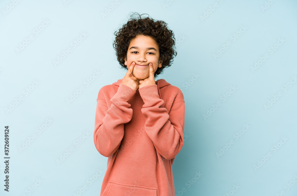 African american little boy isolated doubting between two options. African american little boy isolated doubting between two options.