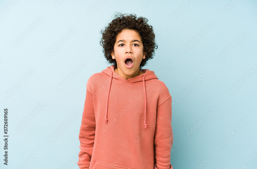 African american little boy isolated screaming very angry and aggressive. African american little boy isolated screaming very angry and aggressive.