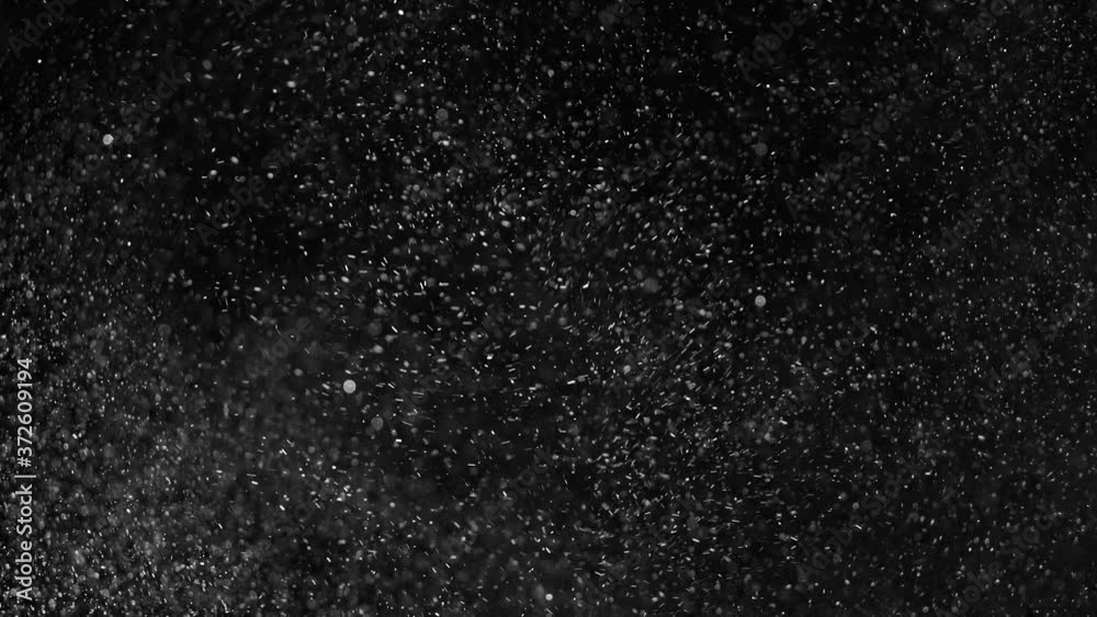 Real golden glitter shot in slow motion. Clouds of gold particles flying in wind on black background. Gold dust beautiful bokeh abstract background. Golden Particles ( glitters background ) . Real golden glitter shot in slow motion. Clouds of gold particles flying in wind on black background. Gold dust beautiful bokeh abstract background. Golden Particles ( glitters background ) .