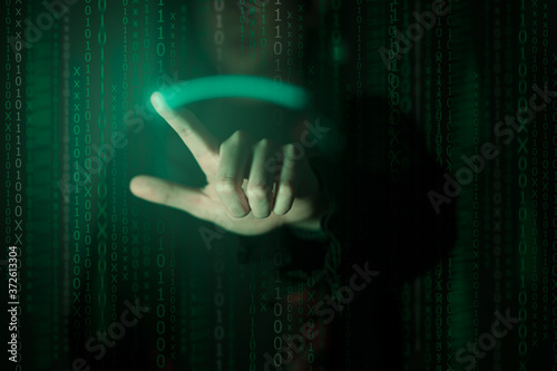 Hacker standing in the dark.Cybercrime concept.