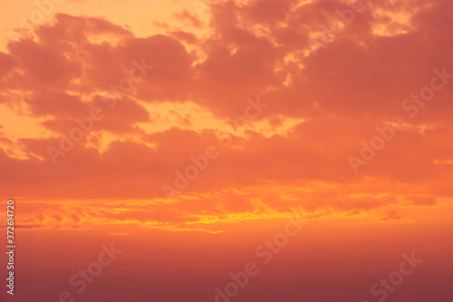 brown and orange sky and clouds in sunset view background