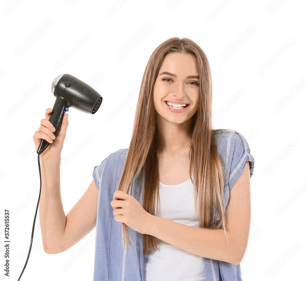Young woman with hair dryer on white background Young woman with hair dryer on white background