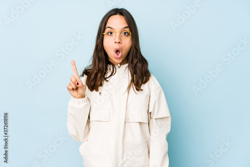 Young mixed race hispanic woman isolated pointing upside with opened mouth.