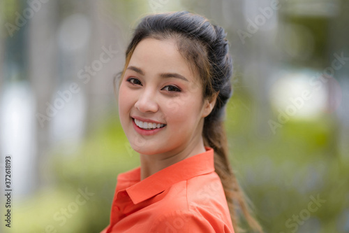 Outdoors portrait of Happy young woman