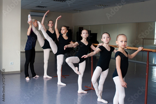 Children are taught ballet positions in choreography.