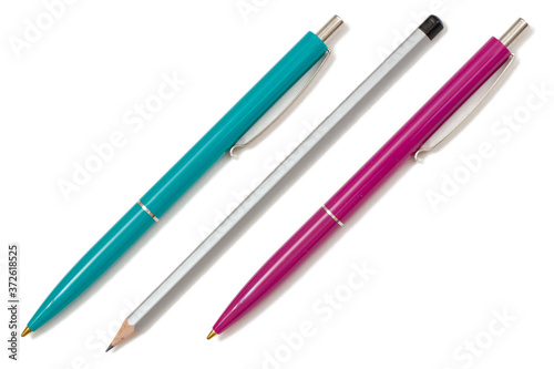 Two plastic pens and pencil on white isolated background.
