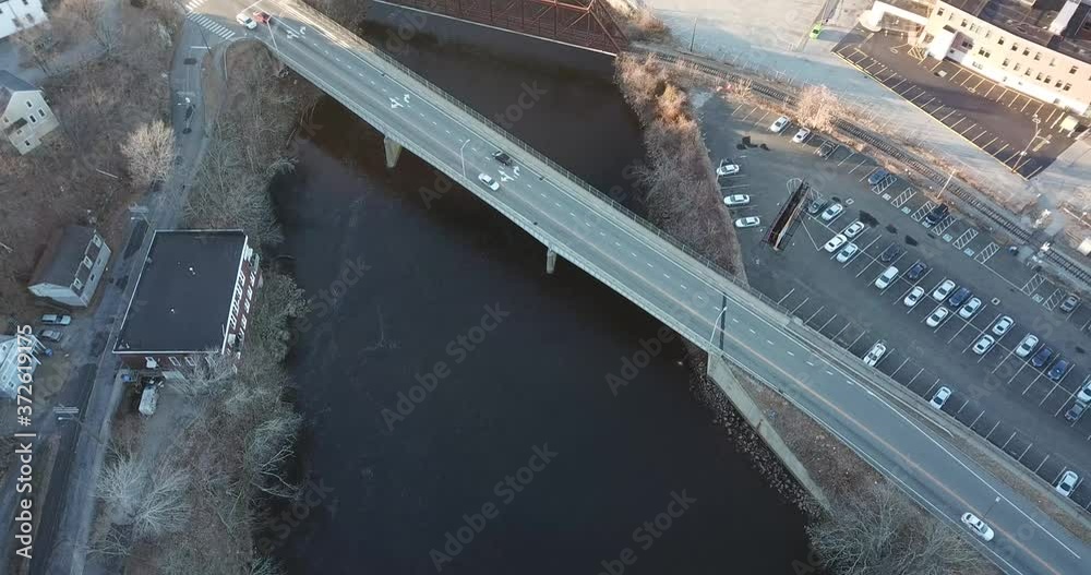 drone shot of bridge with cars driving on it going over water drone shot of bridge with cars driving on it going over water