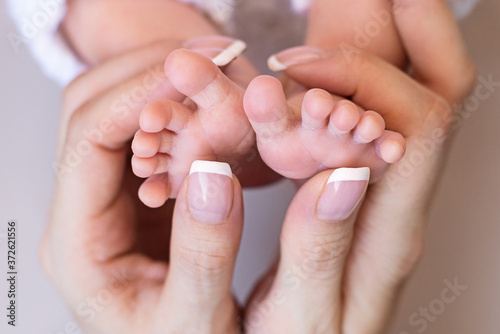 Newborn baby feet. Motherhood concept. Mother day. Copy space. Newborn baby feet. Motherhood concept. Mother day. Copy space. Selective focus