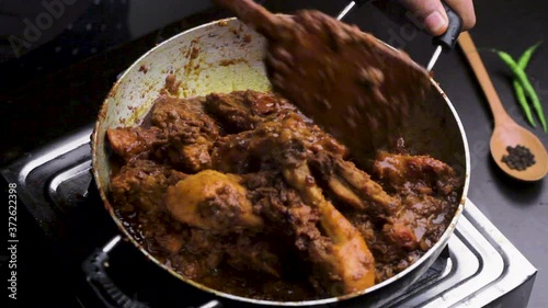 Wallpaper Mural stiring and cooking chicken curry in a pan Torontodigital.ca