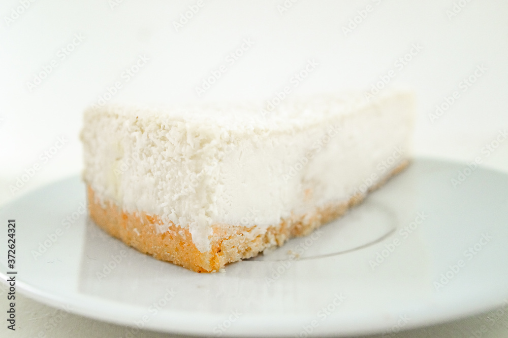 Cheesecake slice, New York style classical cheese cake. Slice of tasty cake on white plate Cheesecake slice, New York style classical cheese cake. Slice of tasty cake on white plate