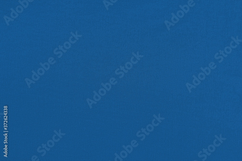 Sapphire homogeneous background with a textured surface, fabric.