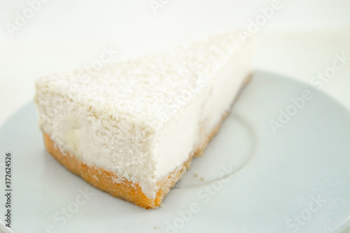 Cheesecake slice  New York style classical cheese cake. Slice of tasty cake on white plate 