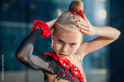 portrait of a girl gymnast performing a temperamental dance