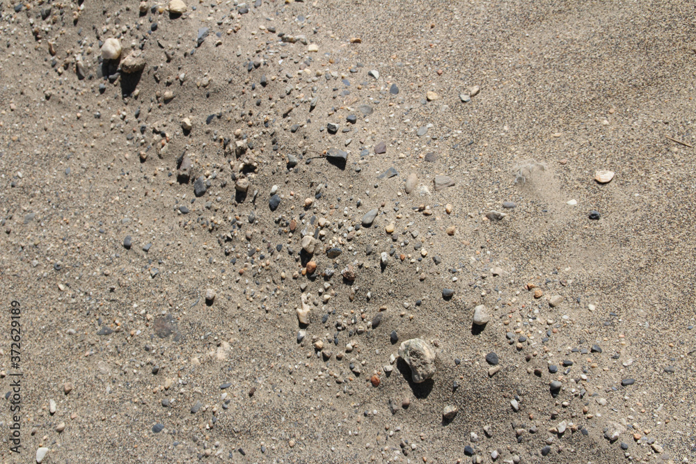 Stones on sand dunes near Tingri on the way to Everest Base Camp, Tibet, China Stones on sand dunes near Tingri on the way to Everest Base Camp, Tibet, China