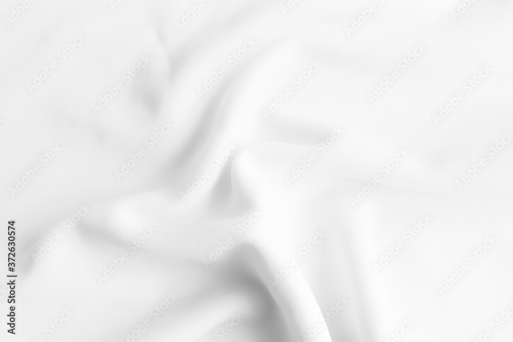 White abstract wavy clothes background. fabric texture