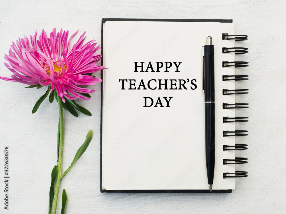 Naklejka premium Happy Teacher's Day. Beautiful greeting card. Close-up, view from above. National holiday concept. Congratulations for family, relatives, friends and colleagues