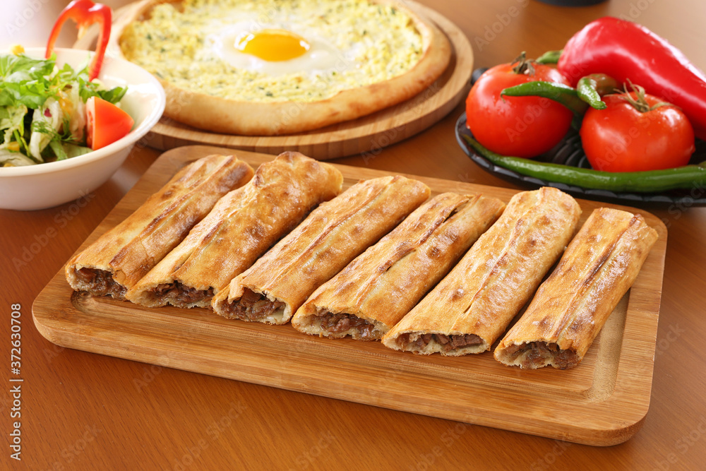 Traditional turkish flavor kapalı pide, Turkish pizza with minced beef Traditional turkish flavor kapalı pide, Turkish pizza with minced beef