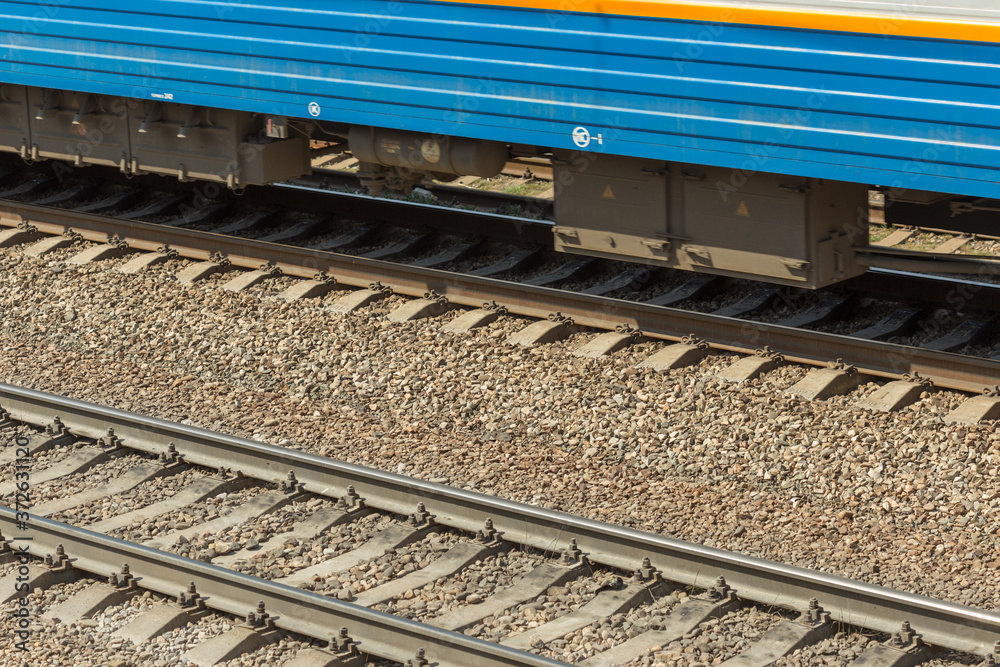 Fototapeta premium blue passenger train moving fast