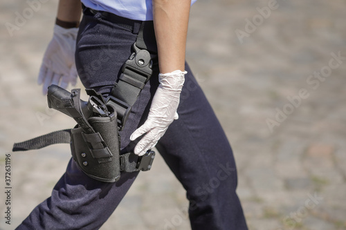 Details with a brand new Beretta PX4 gun in the holster of a Romanian female police officer during an event of the Police Force.