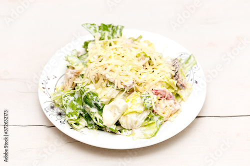 vegetable cabbage salad with mayonnaise and cheese, eggs on the table