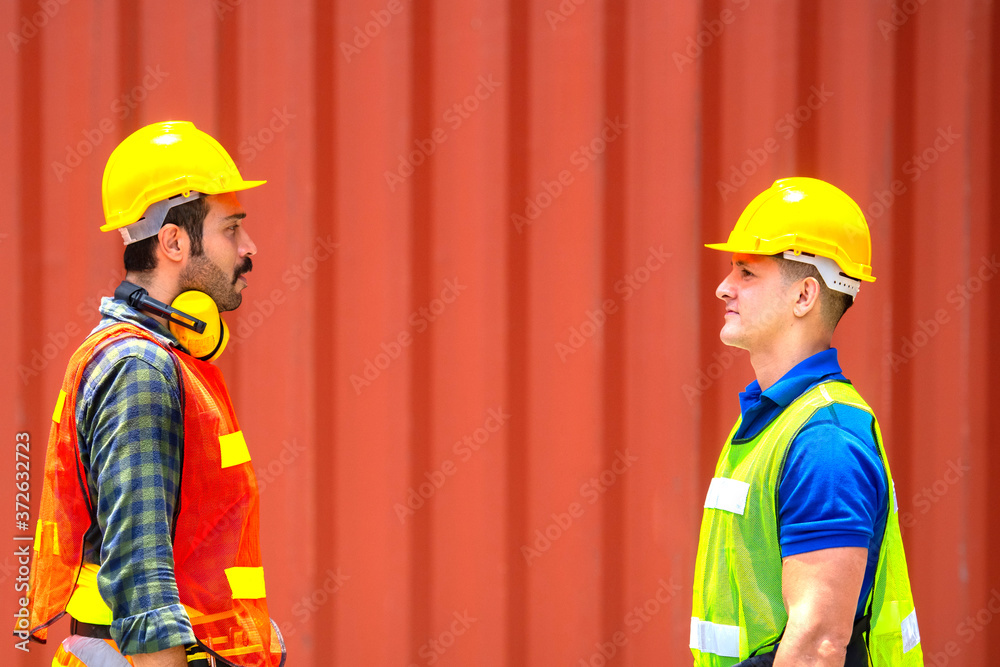 Industrial worker working at cargo freight logistic warehouse. Import and export business. Industrial worker working at cargo freight logistic warehouse. Import and export business.