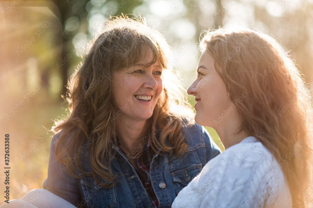 Mother and adult daughter outdoor talk Mother and adult daughter outdoor talk