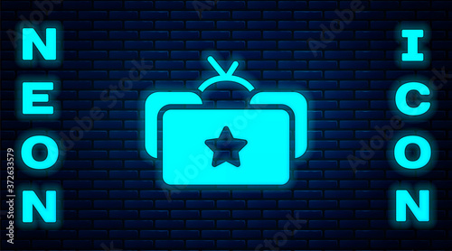 Glowing neon Ushanka icon isolated on brick wall background. Russian fur winter hat ushanka with star. Soviet Union uniform of KGB and NKVD. Vector.