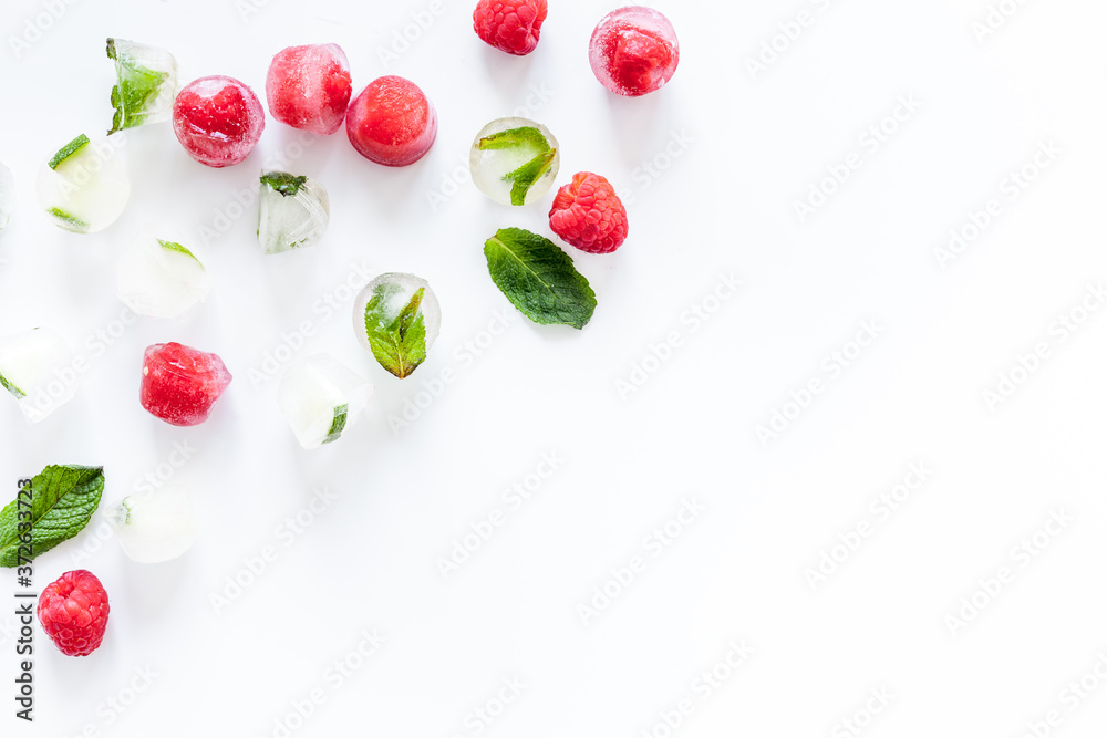 Berries frozen in ice cubes flat lay frame copy space Berries frozen in ice cubes flat lay frame copy space