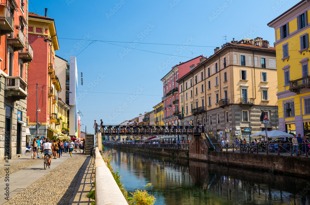 Bridge across water of Naviglio Grande canal waterway, Milan, Italy
