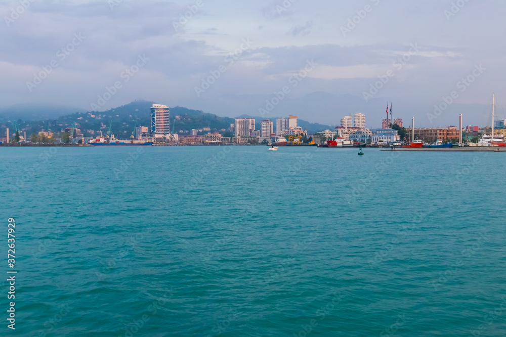 Batumi, Adjara, Georgia. View from the sea on resort town at evening