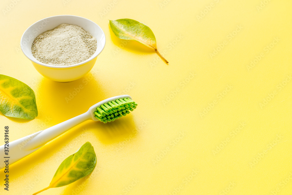 Herbal dental tooth powder with toothbrush. Health care and hygiene concept