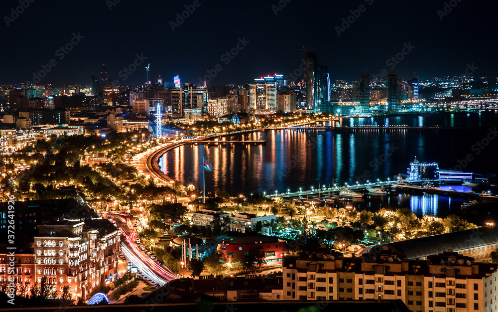 Fototapeta premium Night view of the cityscape on the coast 