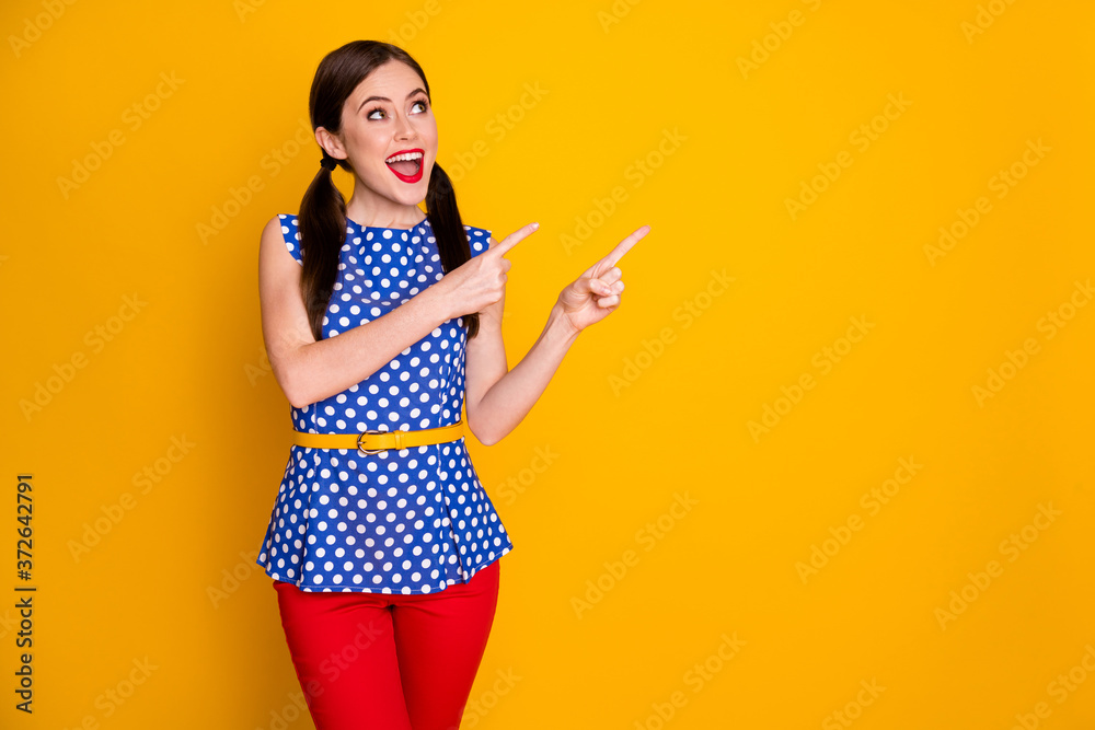 Portrait of her she nice-looking attractive pretty glad glamorous cheerful cheery girl showing gift present product ad advert copy space isolated on bright vivid shine vibrant yellow color background Portrait of her she nice-looking attractive pretty glad glamorous cheerful cheery girl showing gift present product ad advert copy space isolated on bright vivid shine vibrant yellow color background