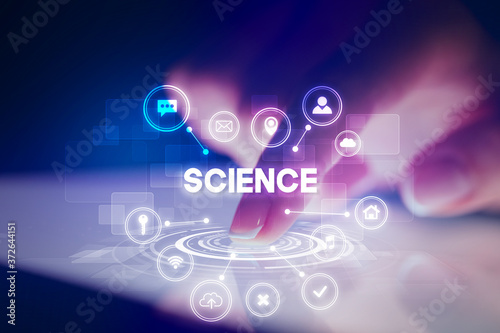 Wallpaper Mural Finger touching tablet with web technology icons and SCIENCE inscription, web technology concept Torontodigital.ca