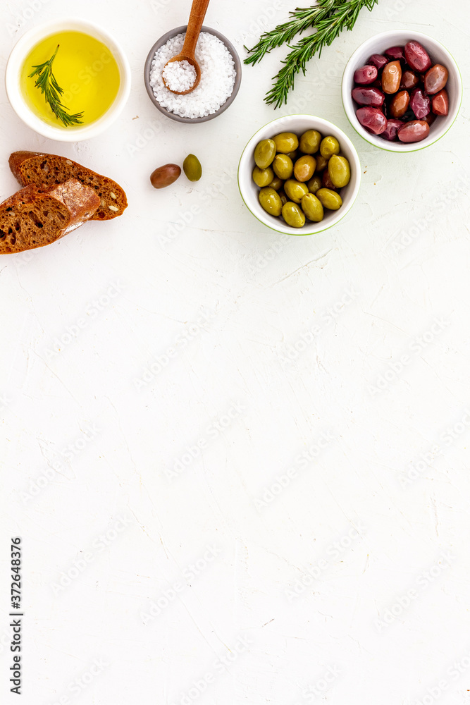 Italian olives, oil, bread - appetizer and snacks - top view copy space Italian olives, oil, bread - appetizer and snacks - top view copy space