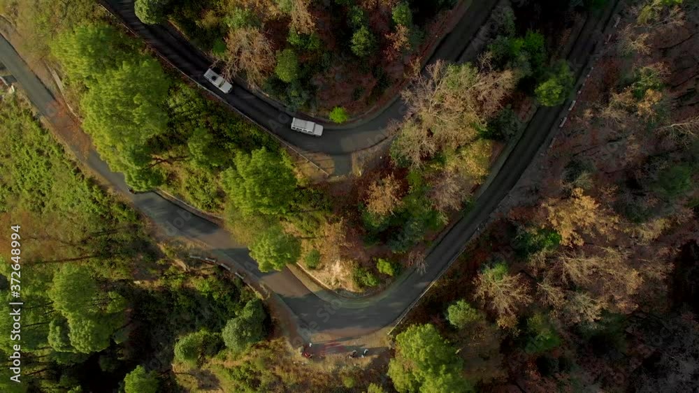 Aerial Top-Down Zoom-Out shot of the  Highway in the Hills Connecting Bir and the top of Paragliding spot in Billing, Himachal Pradesh, shot with a drone in 4k.