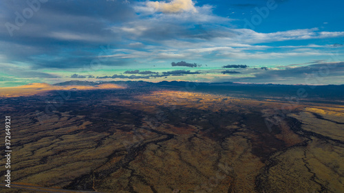 aerial view of a colorful landscape and sky with clouds