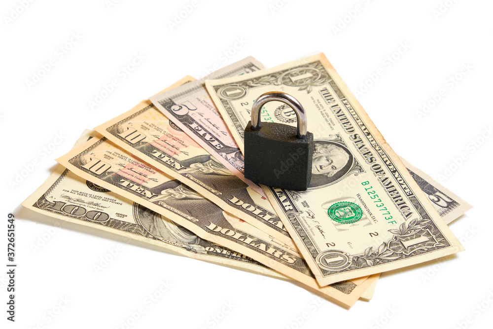 Dollar banknotes and padlock isolated on white. Financial security, money savings Dollar banknotes and padlock isolated on white. Financial security, money savings