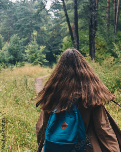 woman in a green forest