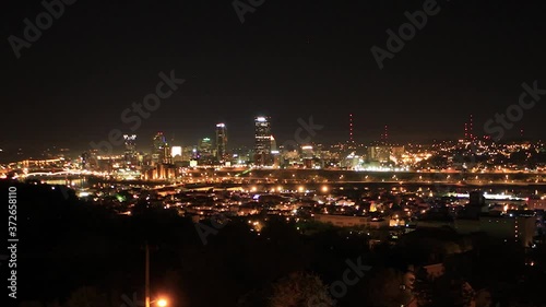 Downtown Pittsburgh Illuminated City Skyline PPG Building at Night Aerial with Water Reflection 4K  photo